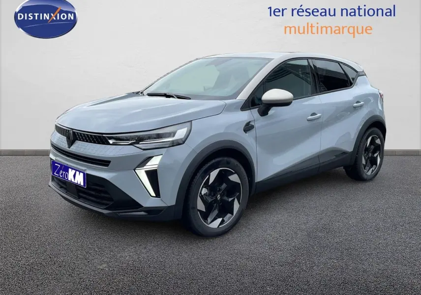 Vue 3/4 avant d'un Renault Captur E-Tech gris rafale avec toit beige et jantes noires au design moderne.