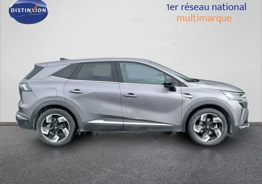 Profil droit du Renault Symbioz 2025 gris cassiopée métallisé avec jantes bi-ton et lignes sculptées.