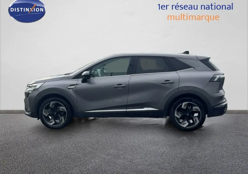 Profil côté gauche du Renault Symbioz 2025 gris cassiopée métal avec jantes noires et détails chromés.