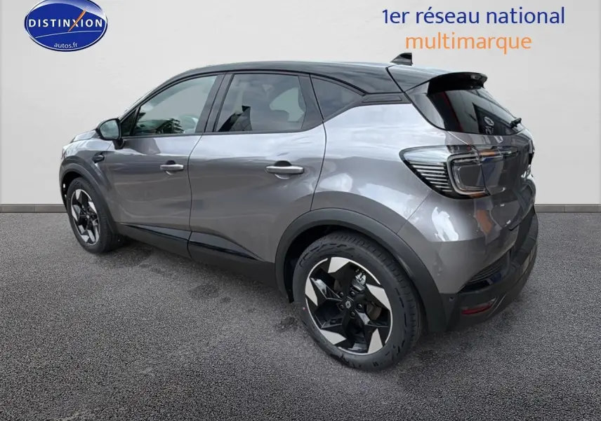 Vue 3/4 arrière droite du Renault Captur gris cassiopée avec jantes alu et toit noir contrasté.