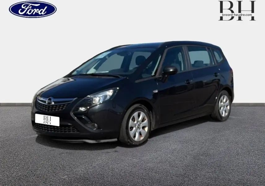 Opel Zafira Tourer gris métal vue 3/4 avant droit sur fond neutre avec jantes argentées visibles.