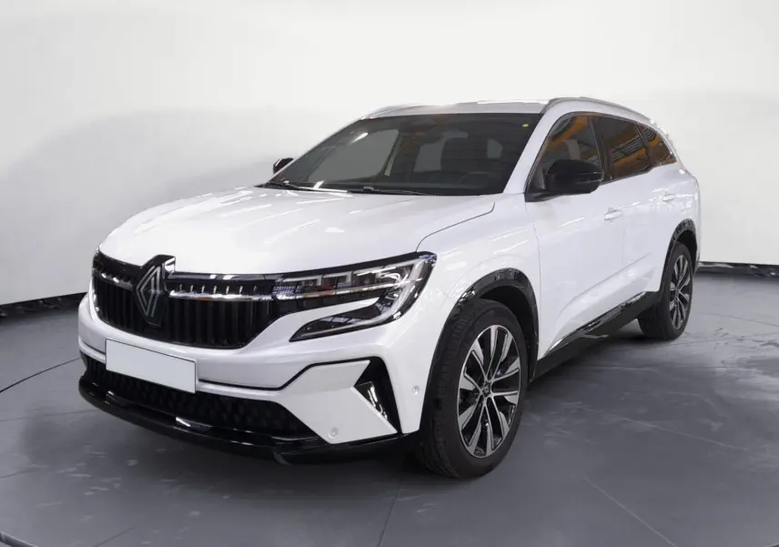 Renault Espace blanc nacré en 3/4 avant droit avec jantes alliage noires et calandre marquée noire brillante.