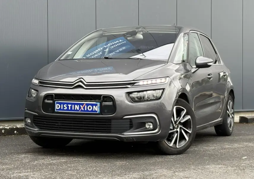 Citroën C4 Spacetourer gris foncé en 3/4 avant droit avec jantes alliage et feux LED allumés.