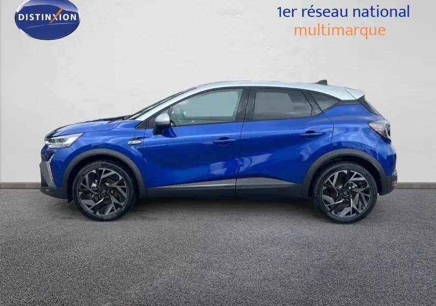 Profil côté gauche du Renault Captur E-Tech hybride 2025 en bleu Iron Metal avec toit gris et jantes noires.