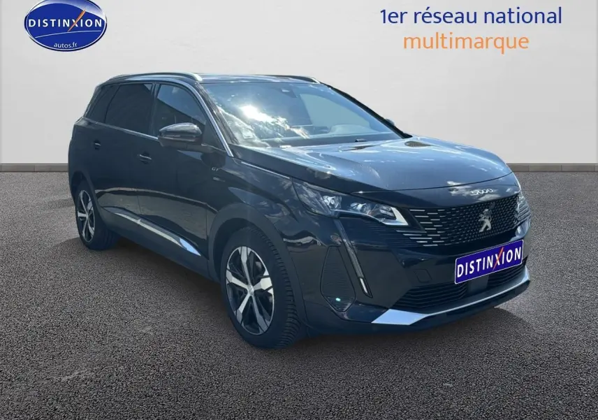 Peugeot 5008 noir métal vue 3/4 avant droit avec jantes alu et barres de toit visibles