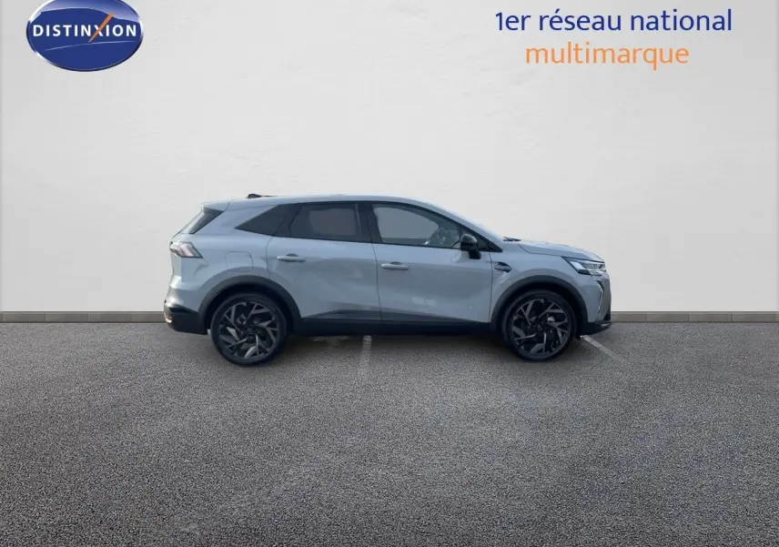 Profil côté droit du Renault Symbioz gris rafale 2024, SUV hybride avec jantes noires distinctives.