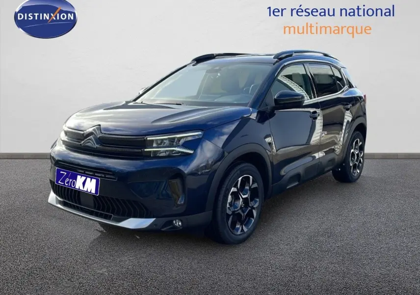 Citroën C5 Aircross bleu Eclipse Metal en 3/4 avant droit, avec jantes noires et détails chromés visibles.