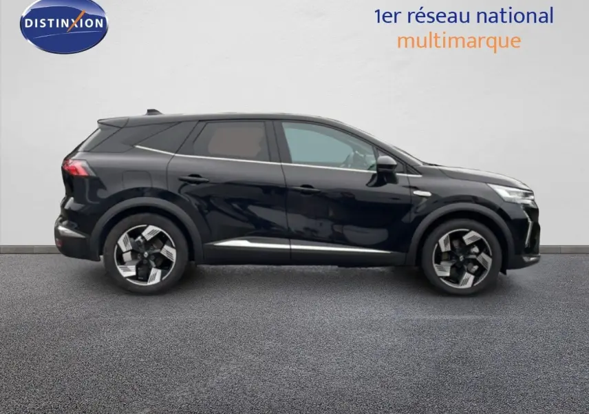 Profil droit du Renault Symbioz 1.6 E-Tech Full Hybrid noir étoile métal avec jantes bi-ton et lignes modernes.