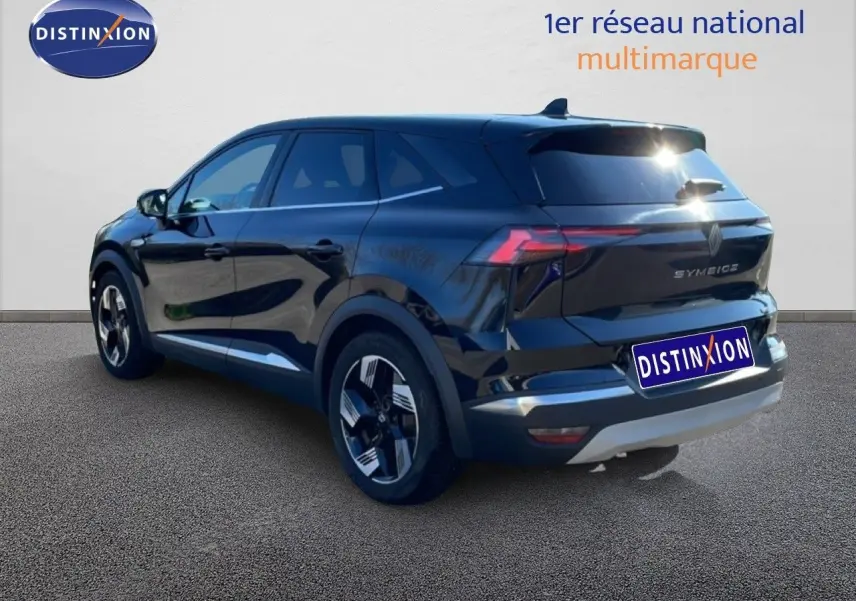 Vue 3/4 arrière droite du Renault Symbioz noir étoile métal, soulignant ses feux LED et ses jantes bicolores modernes.