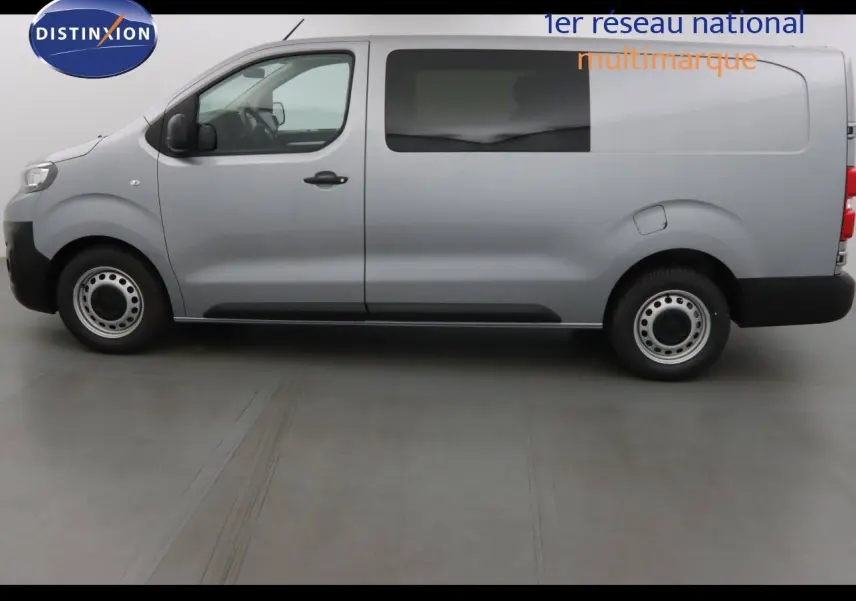 Vue latérale droite d'un utilitaire Peugeot Expert Cabine Approfondie gris Artense Métal avec fenêtre latérale et jantes acier.