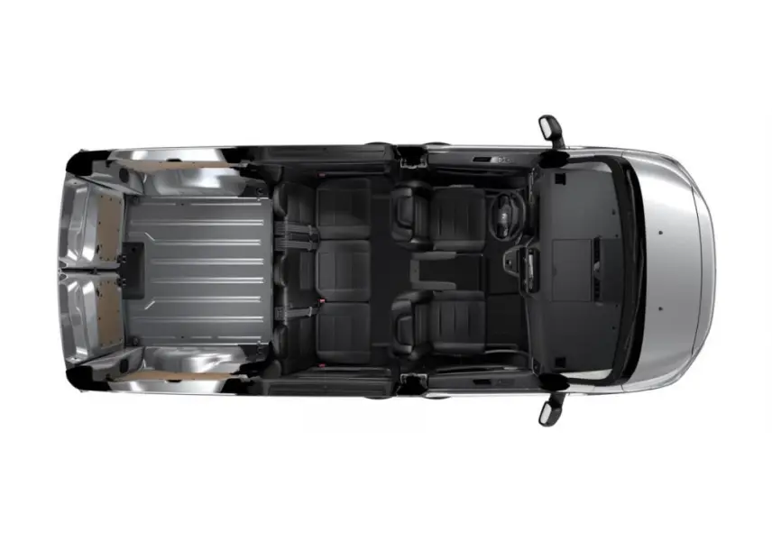 Vue aérienne intérieure du Citroën Jumpy gris, cabine approfondie avec sièges noirs et espace de chargement métallique.