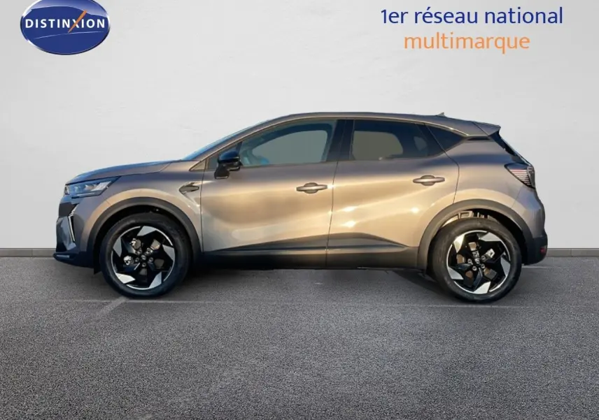 Profil latéral droit du Renault Captur E-Tech hybride 2025 en gris cassiopée métal avec jantes noires bicolores.
