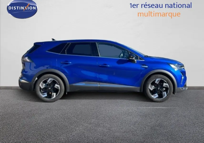 Profil droit du Renault Symbioz 2025 bleu Iron Metal, SUV hybride avec jantes bi-ton et lignes modernes.