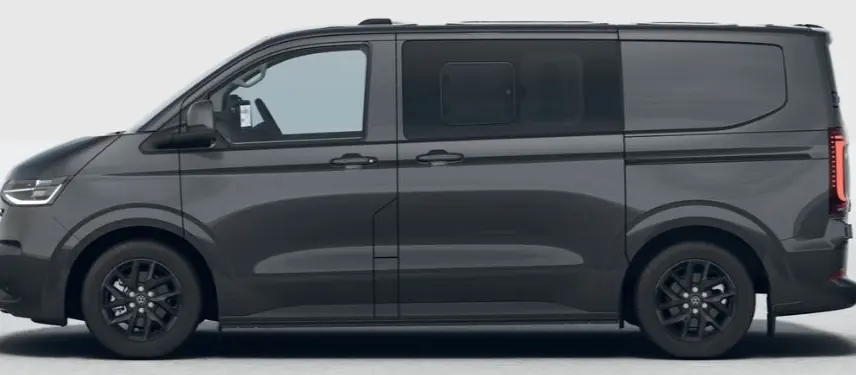 Vue de profil côté gauche d'un Volkswagen Transporter ProCab gris métallisé avec jantes alliage noires et vitres arrière assombries.