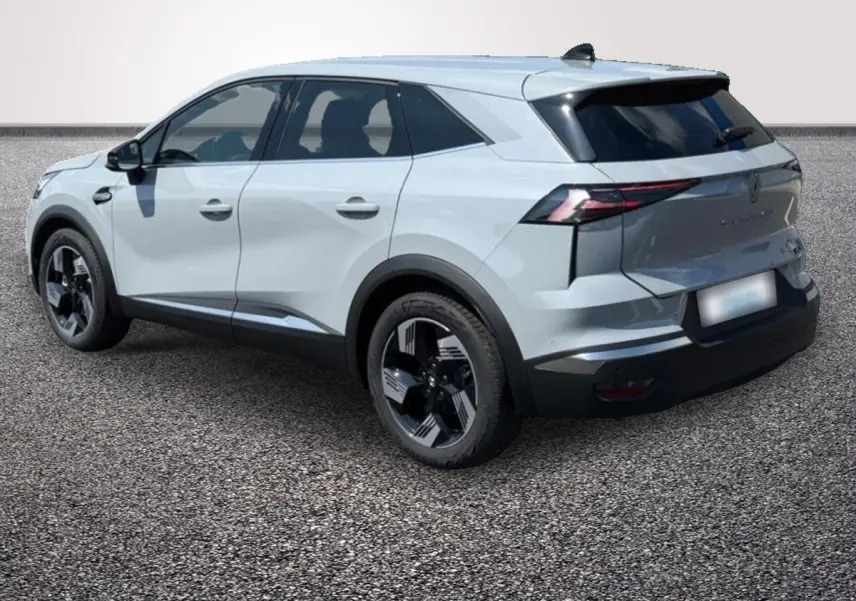 Renault Symbioz gris clair en vue 3/4 arrière droit, avec jantes noires et vitres teintées.