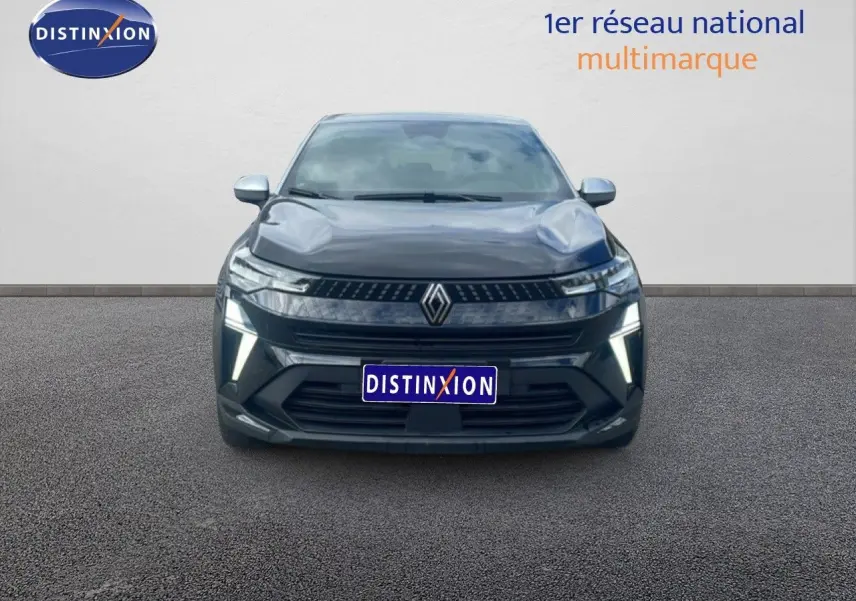 Vue avant d’un Renault Captur 2025 noir étoile métal avec toit gris, mettant en valeur sa calandre et ses feux LED distinctifs.