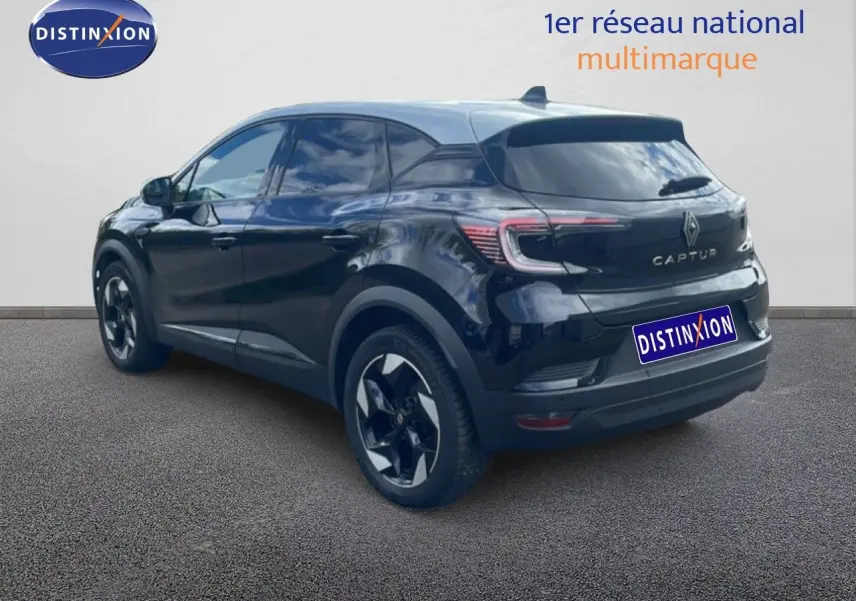 Renault Captur 2025 noir étoile métal avec toit gris, vue 3/4 arrière côté droit, jantes biton distinctives.