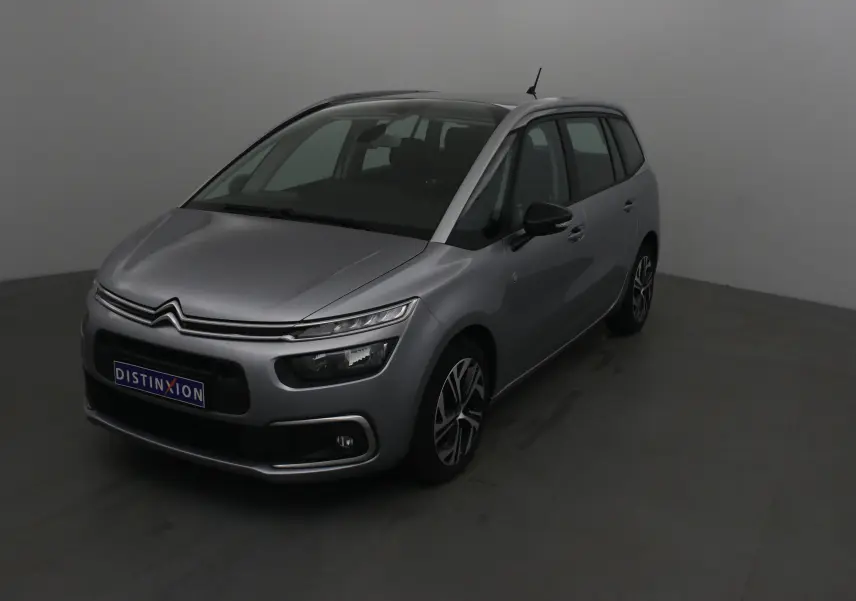 Citroën Grand C4 Spacetourer gris Artense vu en 3/4 avant droit avec ses phares distinctifs et jantes stylées.