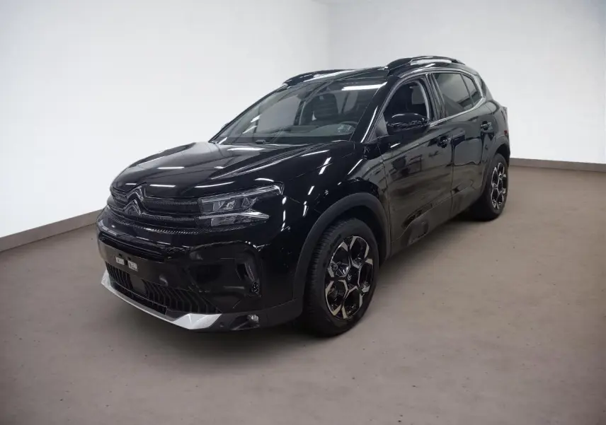 Citroën C5 Aircross Hybrid noir Perla en 3/4 avant droit, avec jantes diamantées bi-ton et barres de toit noires.