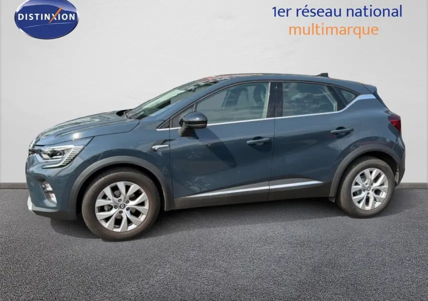 Profil côté gauche du Renault Captur 2022 bleu marine fumé, version hybride essence, avec jantes alliage et détails noirs.