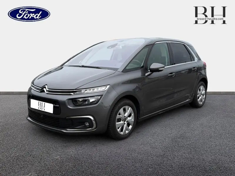 Citroën C4 Spacetourer gris Platinium vue 3/4 avant droit, avec feux LED et jantes alu visibles.