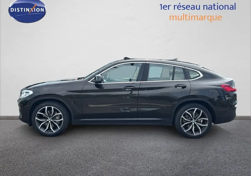 BMW X4 XDRIVE 30D 2019 en Sparkling Storm Métal vue profil côté gauche avec jantes bi-ton et toit incliné.