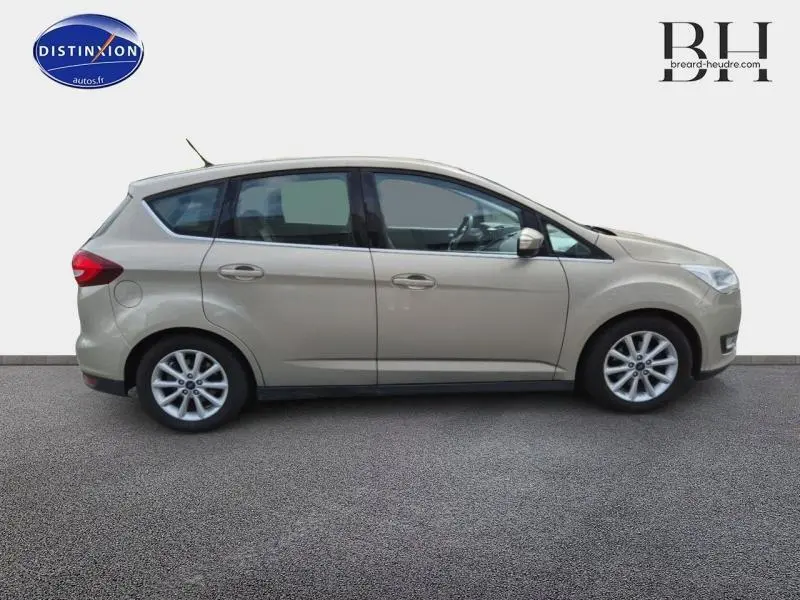Vue latérale droite d'une Ford C-MAX 2018 couleur Fashion Brun Caribou avec jantes alu et vitres teintées.