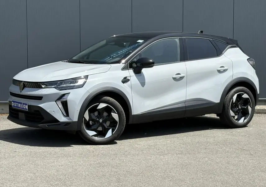 Renault Captur TCE 90 Techno gris Rafale vu de profil droit, toit noir étoilé et jantes noires distinctives.