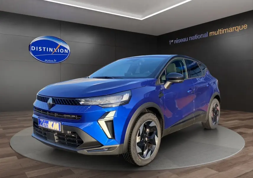 Renault Captur 2025 bleu Iron avec toit noir, vue 3/4 avant droit, mettant en valeur ses optiques fines et jantes noires.