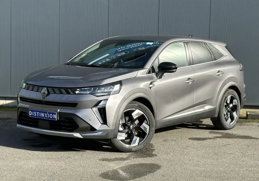 Renault Symbioz gris Cassiopée en 3/4 avant droit, avec jantes 18 pouces et calandre moderne noire.