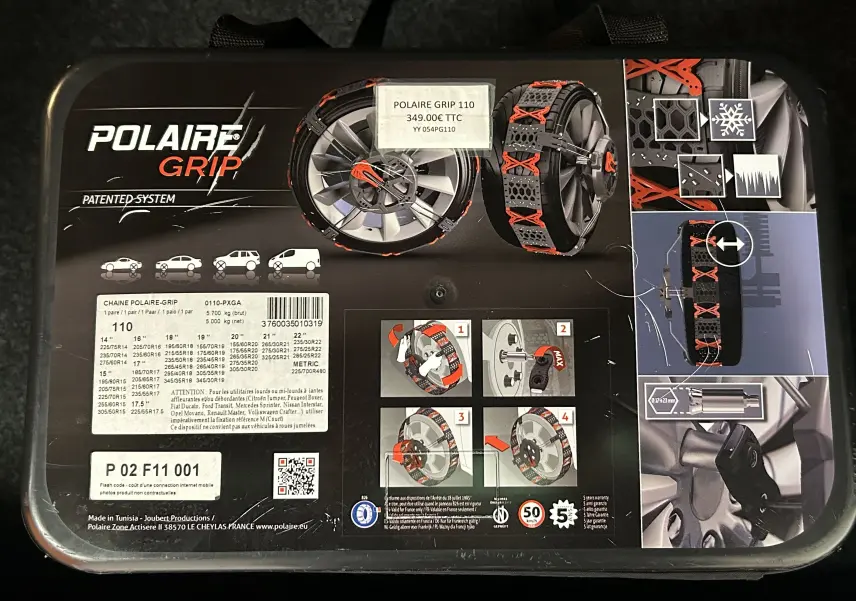 Boîte noire vue de dessus montrant des chaînes à neige Polaire Grip 110 avec illustrations et instructions d'installation.