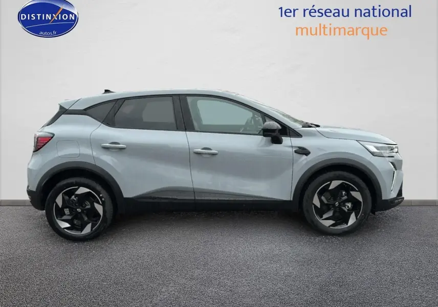 Profil droit du Renault Captur gris rafale 2025 avec jantes alliage noires et détails noirs contrastants.