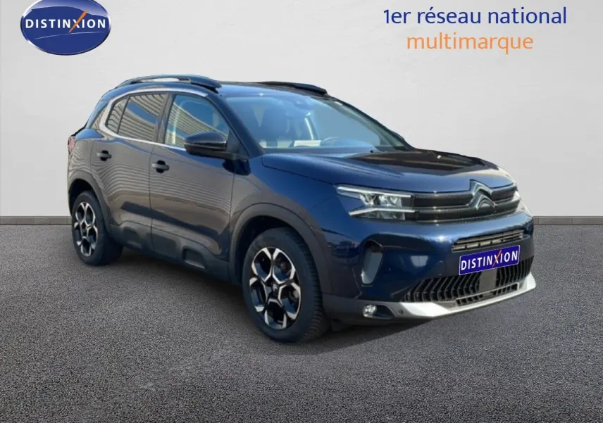 Citroën C5 Aircross bleu Eclipse métal en 3/4 avant droit, avec jantes bi-ton et toit noir contrasté.