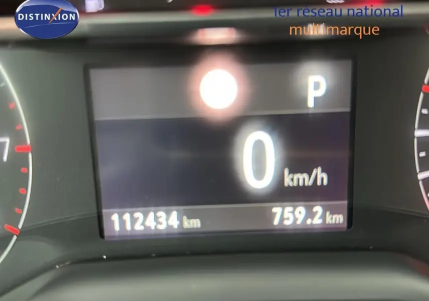 Affichage numérique du tableau de bord de l'Opel Grandland X gris clair, indiquant 0 km/h et 112434 km au compteur.