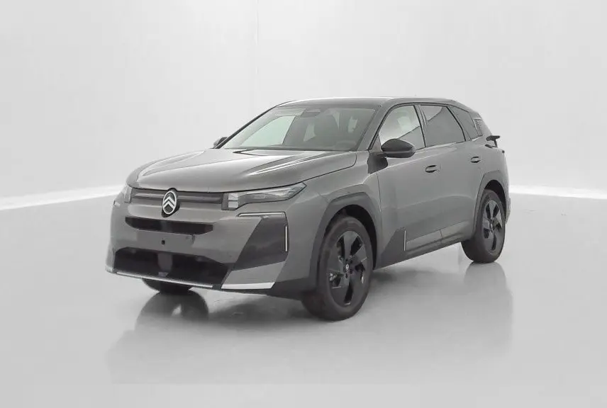 Vue 3/4 avant d'un Citroën C5 Aircross hybride gris platinium avec jantes noires et design moderne épuré.