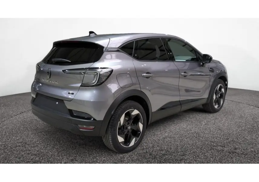 Renault Captur 2026 gris cassiopée en 3/4 arrière droit, avec jantes aluminium noires et vitres surteintées.
