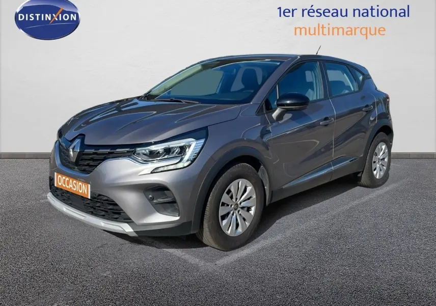 Renault Captur TCE 100CH Corporate Edition gris cassiopée métal en 3/4 avant droit sur sol bitumé.