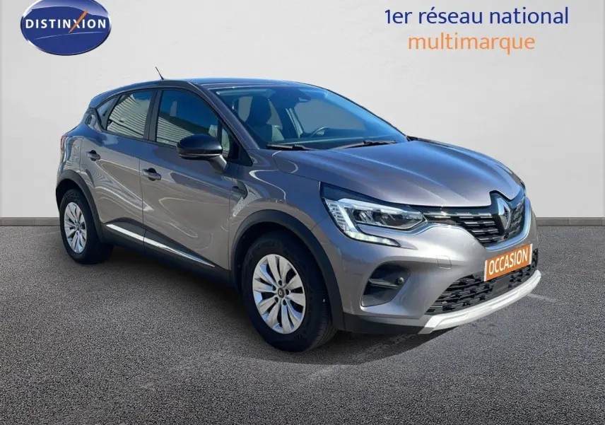 Renault Captur TCE 100ch Corporate Edition gris cassiopée métal, vue 3/4 avant avec feux LED et calandre distinctive.