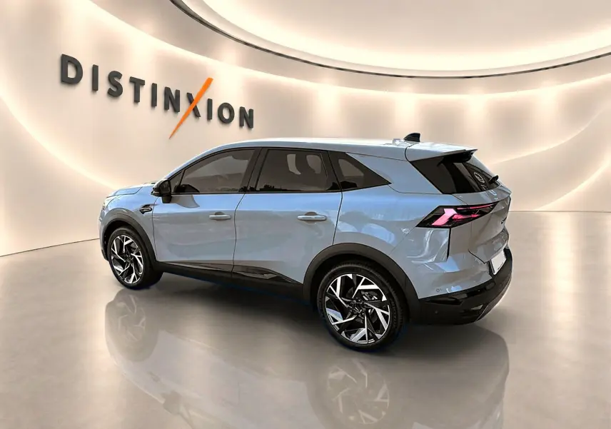Renault Symbioz gris rafale en vue 3/4 arrière droit, avec jantes alu et feux arrière LED distinctifs.