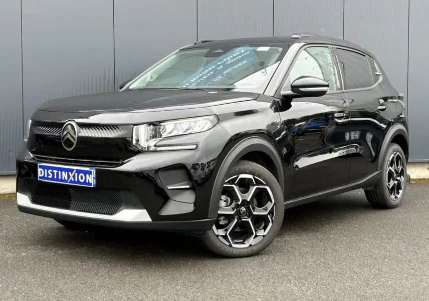 Citroën C3 Turbo 100 Max noir Perla vue 3/4 avant droit avec jantes alliage et barres de toit noires.