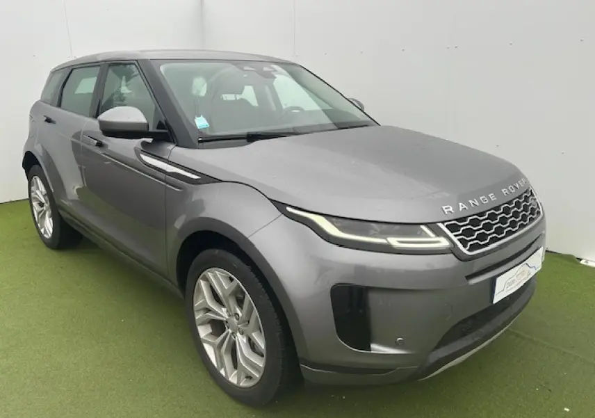 Range Rover Evoque gris foncé métal vu en 3/4 avant gauche avec phares LED et jantes 20 pouces.