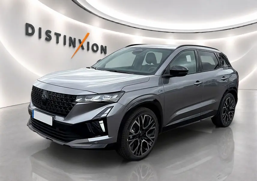Renault Austral gris schiste en 3/4 avant droit, avec calandre noire et jantes alliage distinctives.