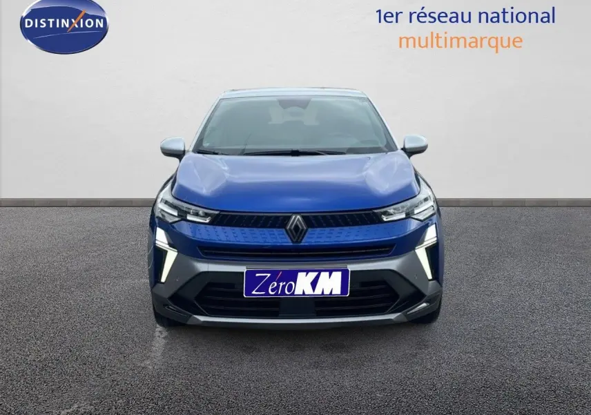 Vue de face du Renault Captur E-Tech hybride 2025 en bleu Iron Metal avec toit gris et feux LED allumés.