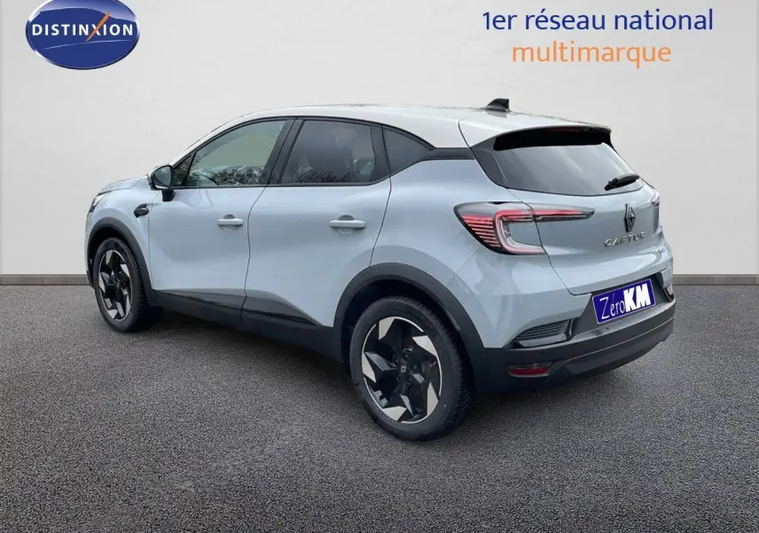 Renault Captur E-Tech hybride gris Rafale en 3/4 arrière côté droit avec toit beige et jantes noires.