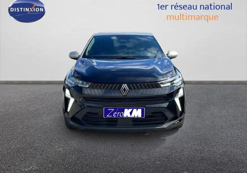 Vue frontale d'un Renault Captur noir étoile métal avec toit gris, mettant en valeur ses phares LED et sa calandre moderne.