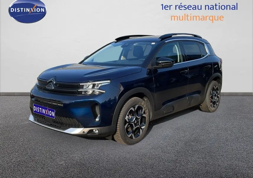 Citroën C5 Aircross bleu Eclipse métal en 3/4 avant droit, SUV hybride avec jantes noires distinctives.