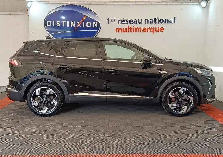 Renault Symbioz Iconic E-Tech hybride noir vu de profil droit, avec jantes distinctives et lignes modernes.