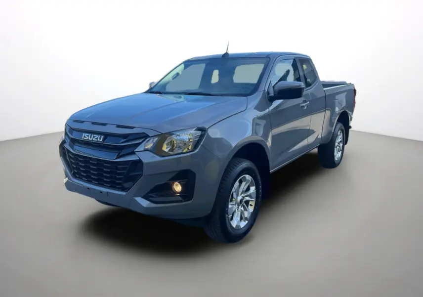 Vue 3/4 avant d’un pick-up Isuzu D-MAX gris Kinabalu avec calandre noire et jantes alu 18 pouces.