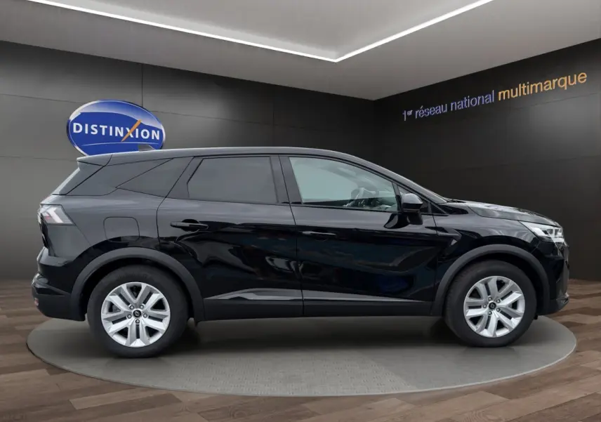 Renault Symbioz noir en profil droit, SUV hybride avec lignes modernes et jantes argentées, en showroom.