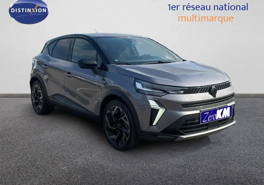 Renault Captur E-Tech hybride gris cassiopée toit noir, vue 3/4 avant avec jantes noires stylées.